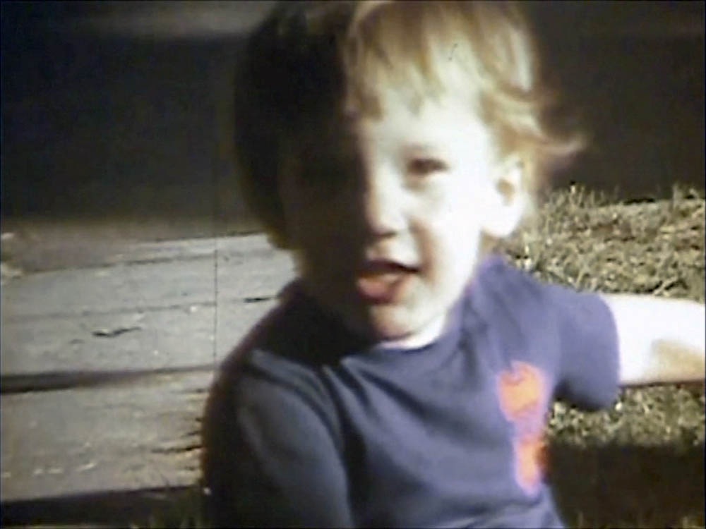 noah on trike in front yard