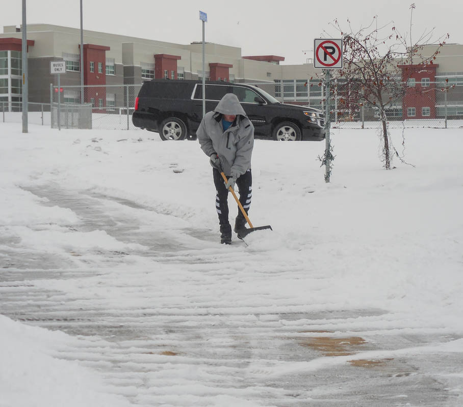 december_noah shoveling snow